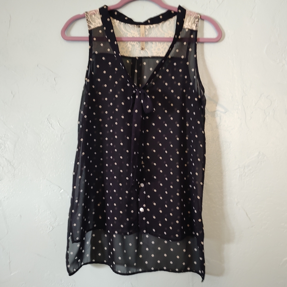 Navy and white polka dot sleeveless blouse